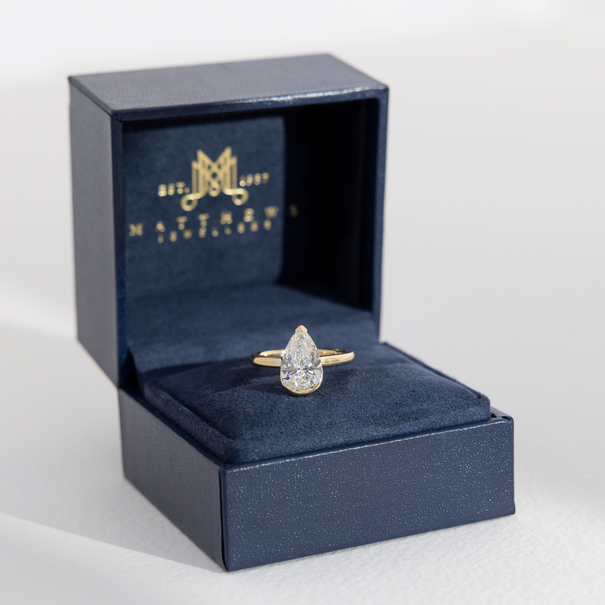 Half Bezel Nora | Pear Solitaire Diamond Engagement Ring