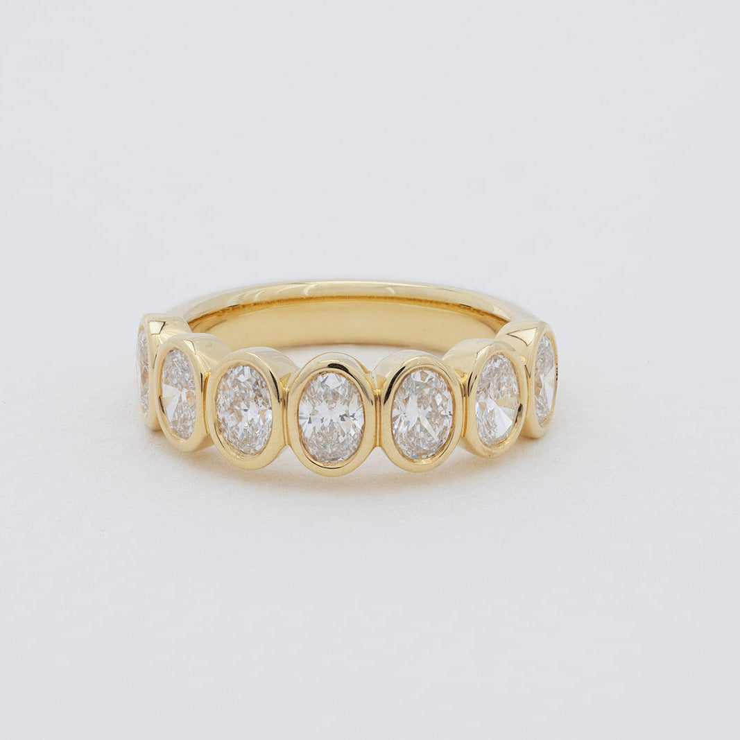 Amari oval diamond wedding ring in 18K gold featuring 7 lab-grown oval diamonds