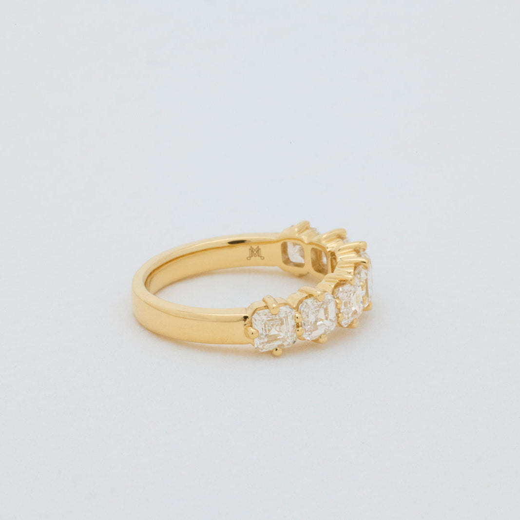 Elegant Asscher diamond ring in 18K gold featuring 7 asscher cut lab-grown diamonds