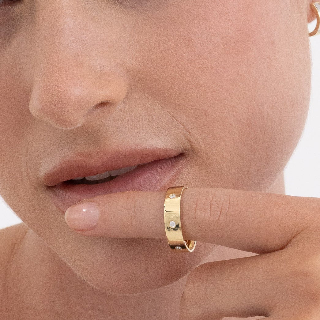 Diamond cigar band ring in 18K gold with brilliant diamond accents, handcrafted by Matthews Jewellers Newcastle
