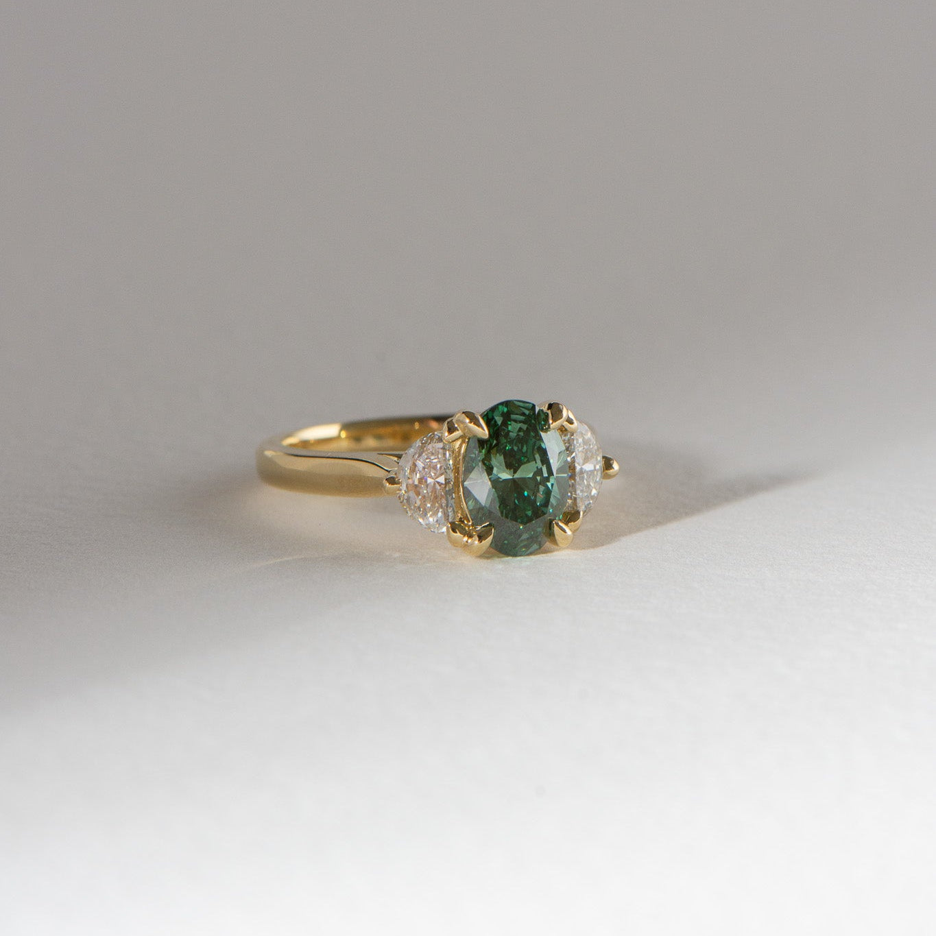 Lina | 1.54ct Oval Cut Green Diamond and Half Moon Trilogy Engagement Ring