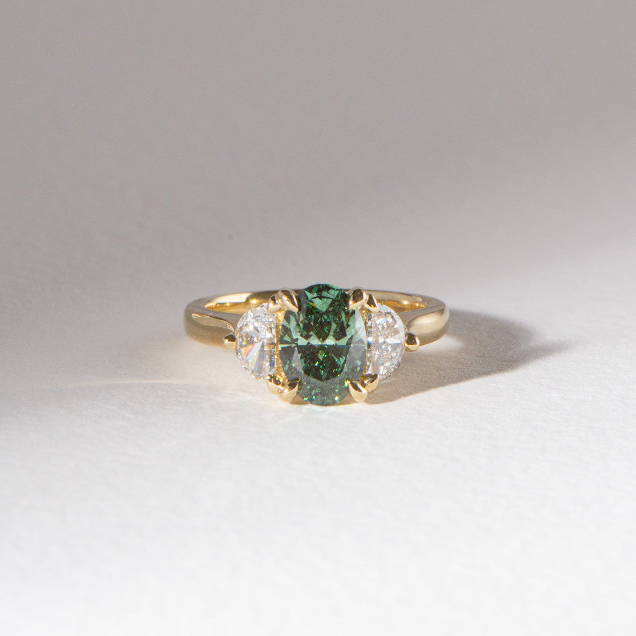 Lina | 1.54ct Oval Cut Green Diamond and Half Moon Trilogy Engagement Ring