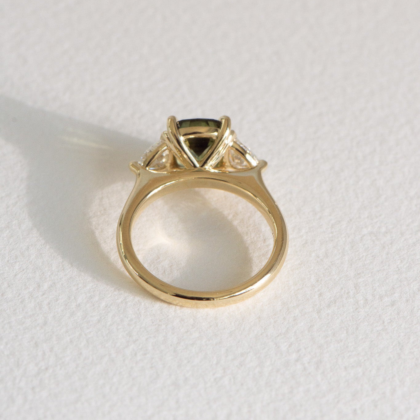 Cushion-cut Australian parti sapphire engagement ring with a 2.61ct natural sapphire, lab-grown diamond, 18k yellow gold cathedral setting.