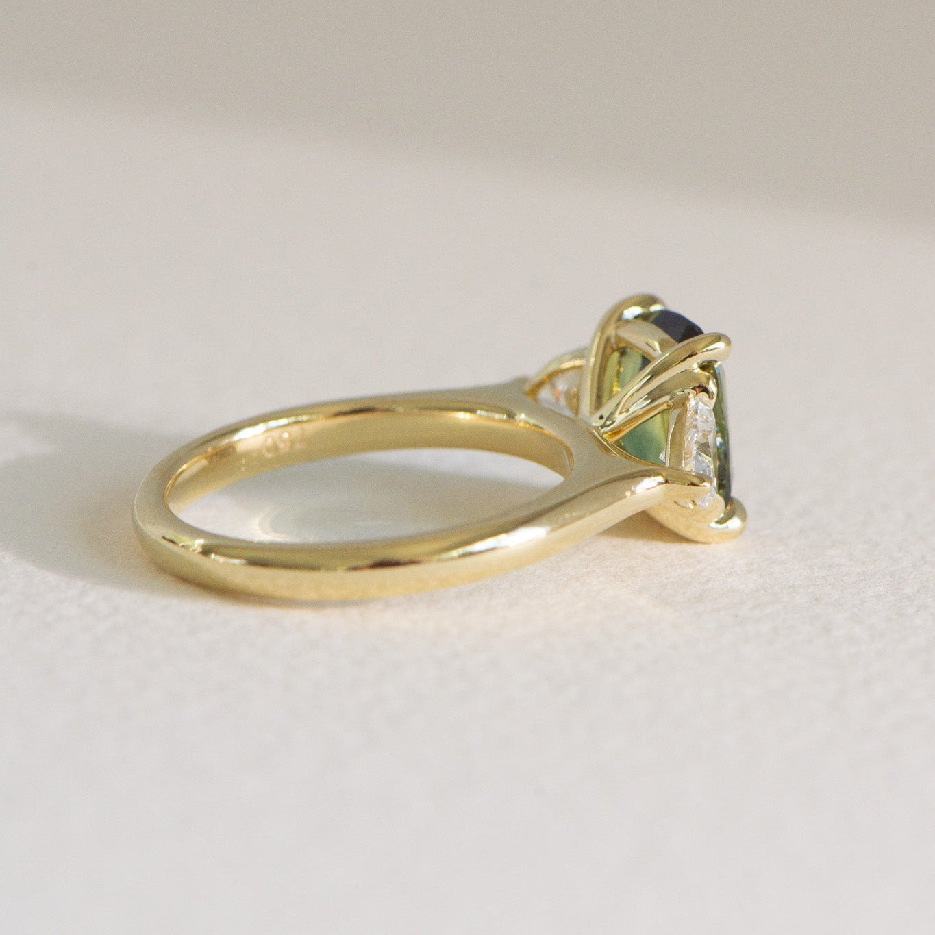 Cushion-cut Australian parti sapphire engagement ring with a 2.61ct natural sapphire, lab-grown diamond, 18k yellow gold cathedral setting.