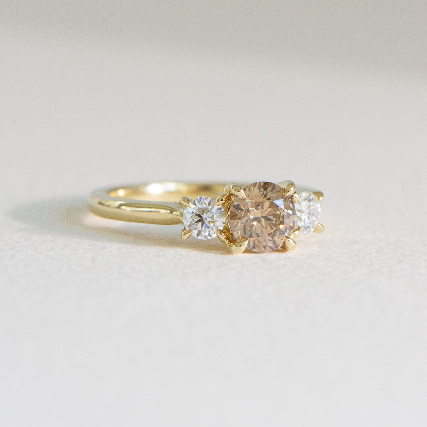 Laila | Natural Champagne Three Stone Round Engagement Ring