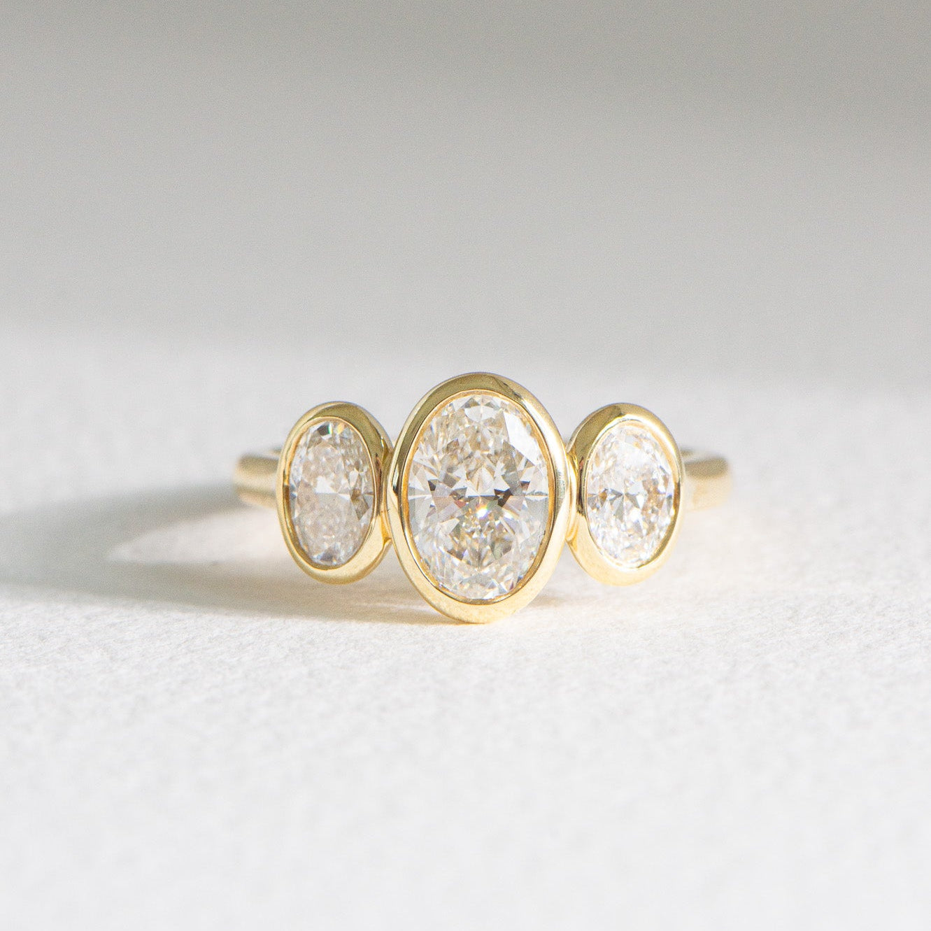 Mae | 2ct Bezel Three Stone Oval Engagement Ring