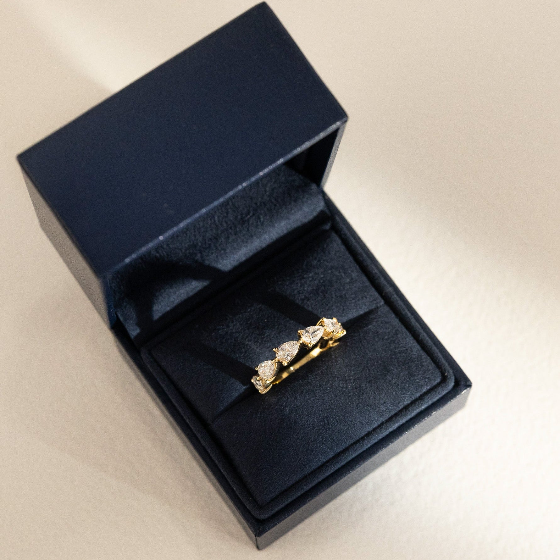 Pear Diamond Ring with 6-7 Diamonds
