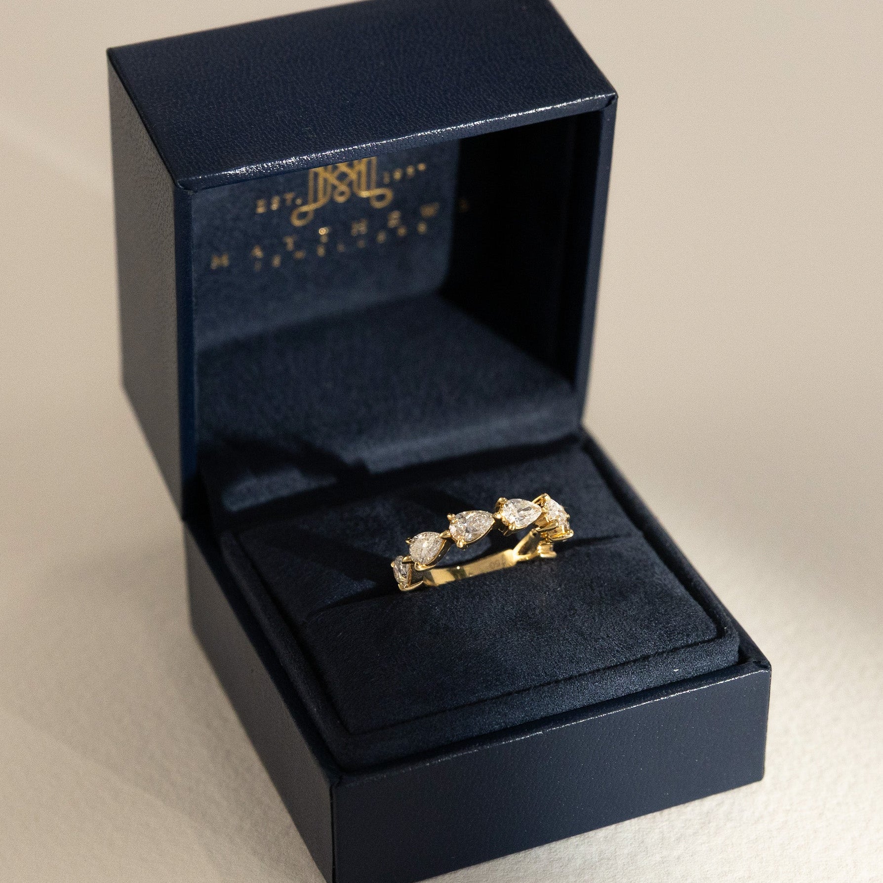 Pear Diamond Ring with 6-7 Diamonds