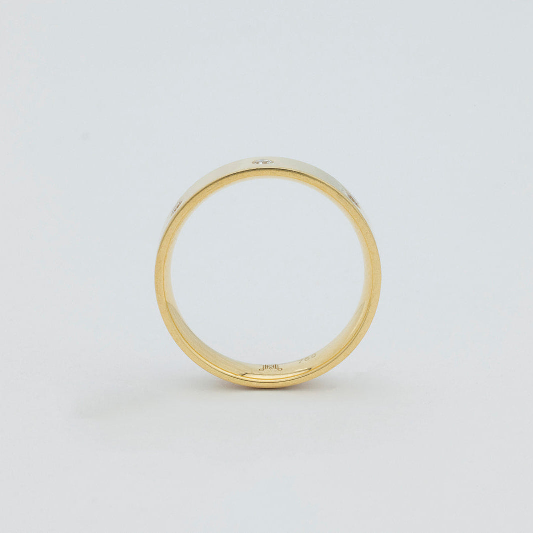 Elegant 18K gold cigar band ring set with brilliant diamonds by Matthews Jewellers Newcastle