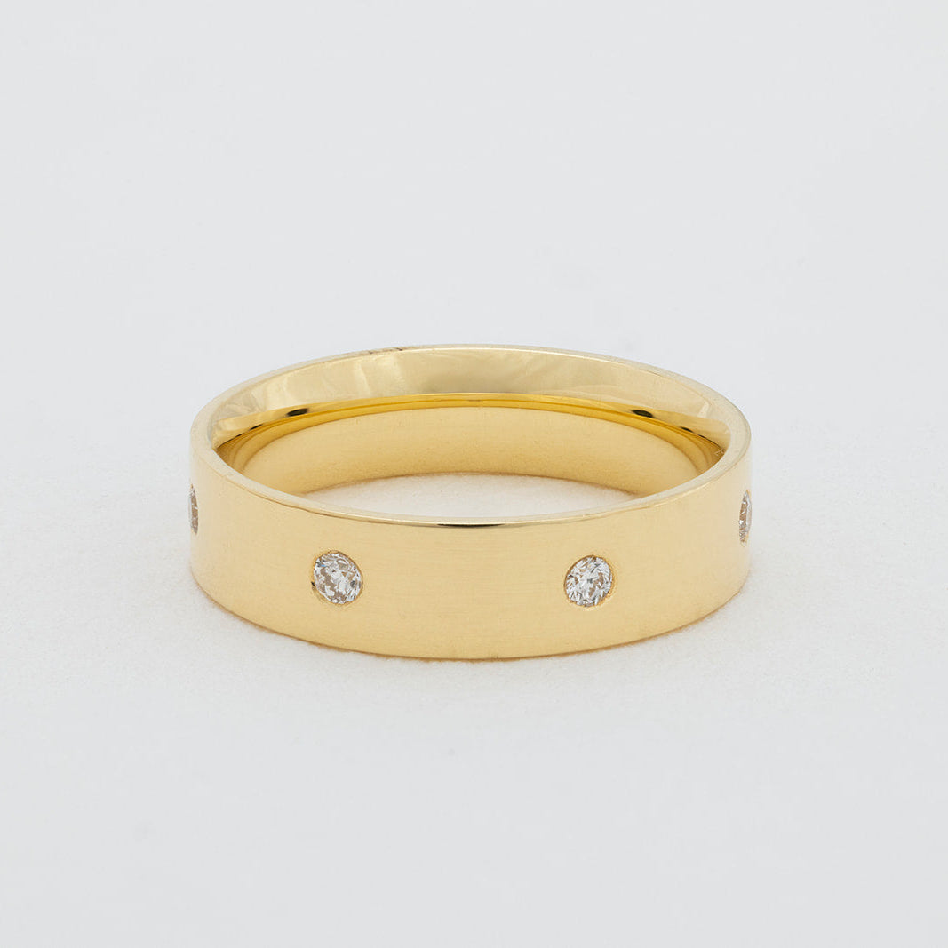 Handcrafted diamond cigar band ring in 18K gold