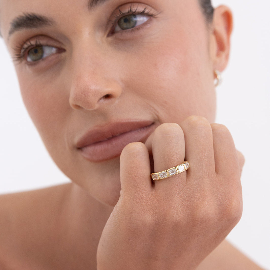 18K gold Emra east west emerald diamond wedding ring with bezel-set lab-grown diamonds