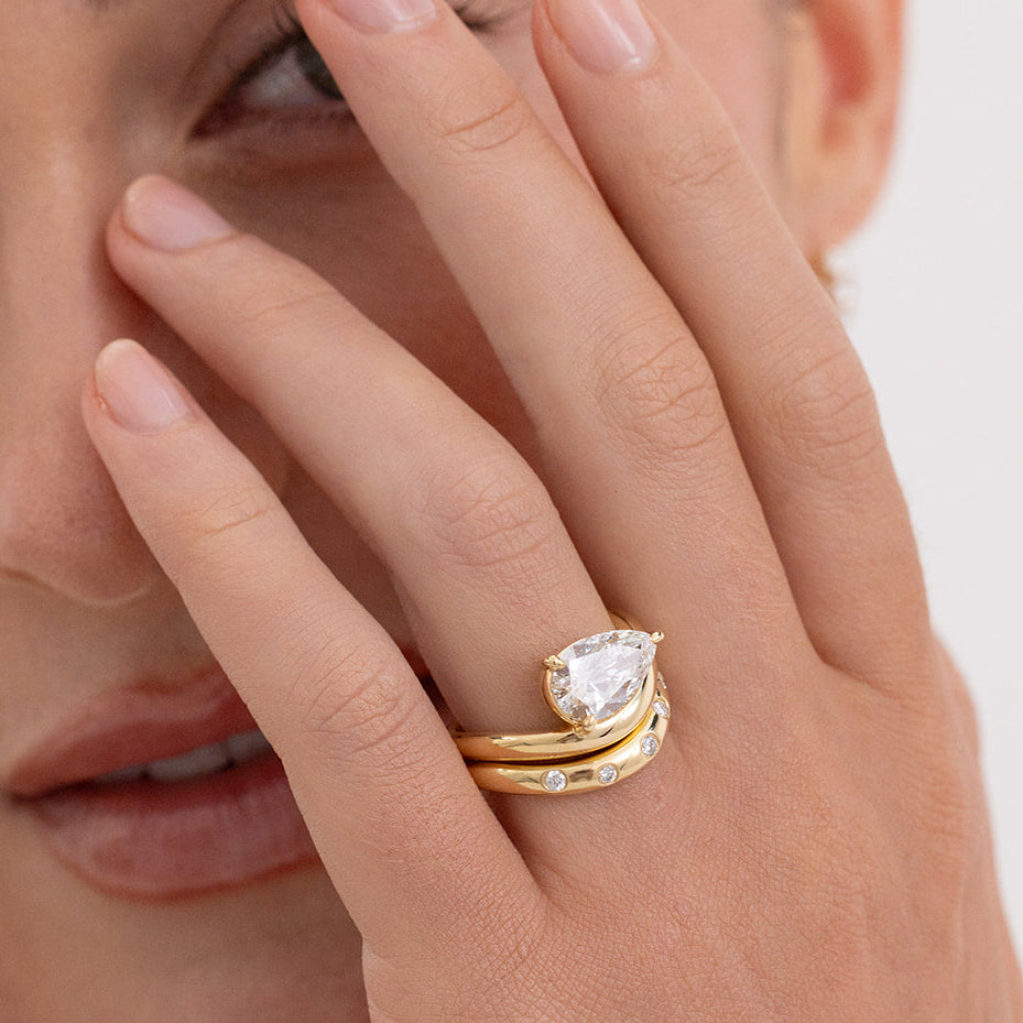 Issy 18K gold curved diamond wedding band designed for a perfect fit