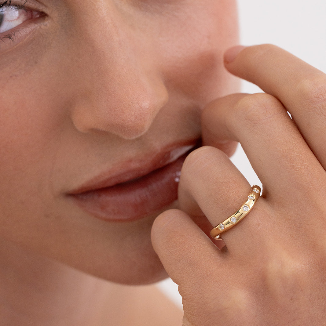 Issy curved diamond wedding band in 18K gold by Matthews Jewellers Newcastle