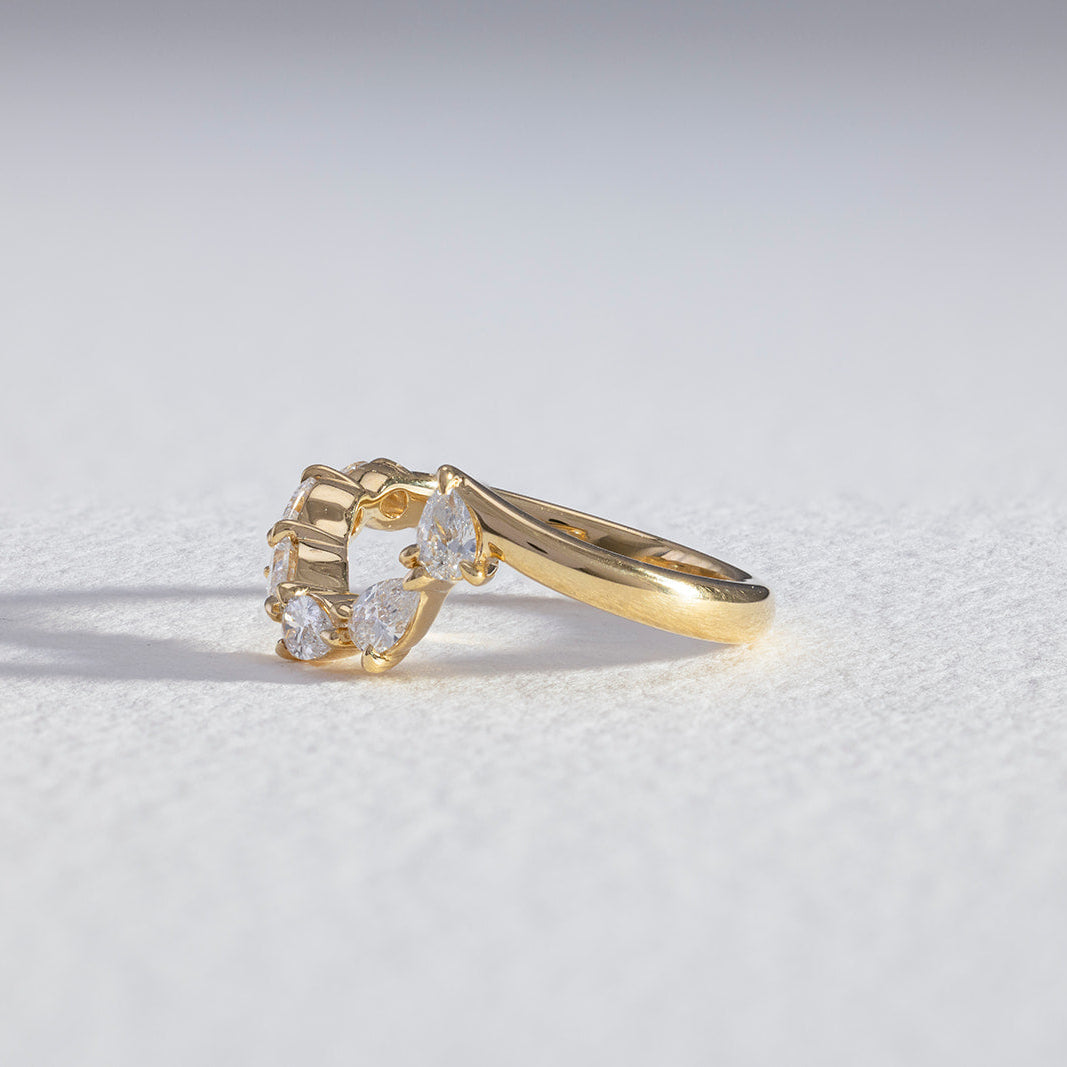The Oriana, a pear curve lab diamond wedding ring, handcrafted since 1957.