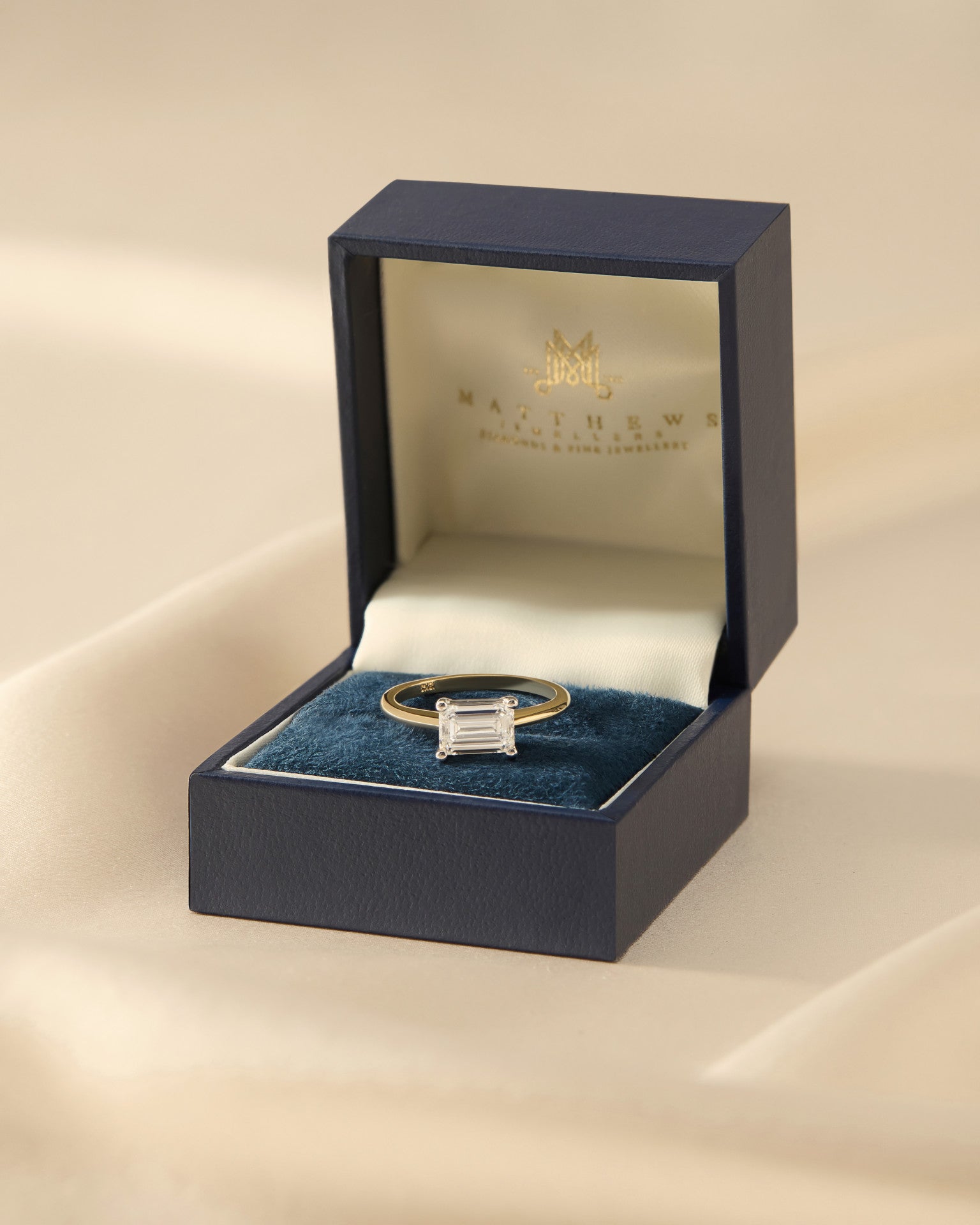 Astrid | Emerald Cut Solitaire Diamond Engagement Ring | East West
