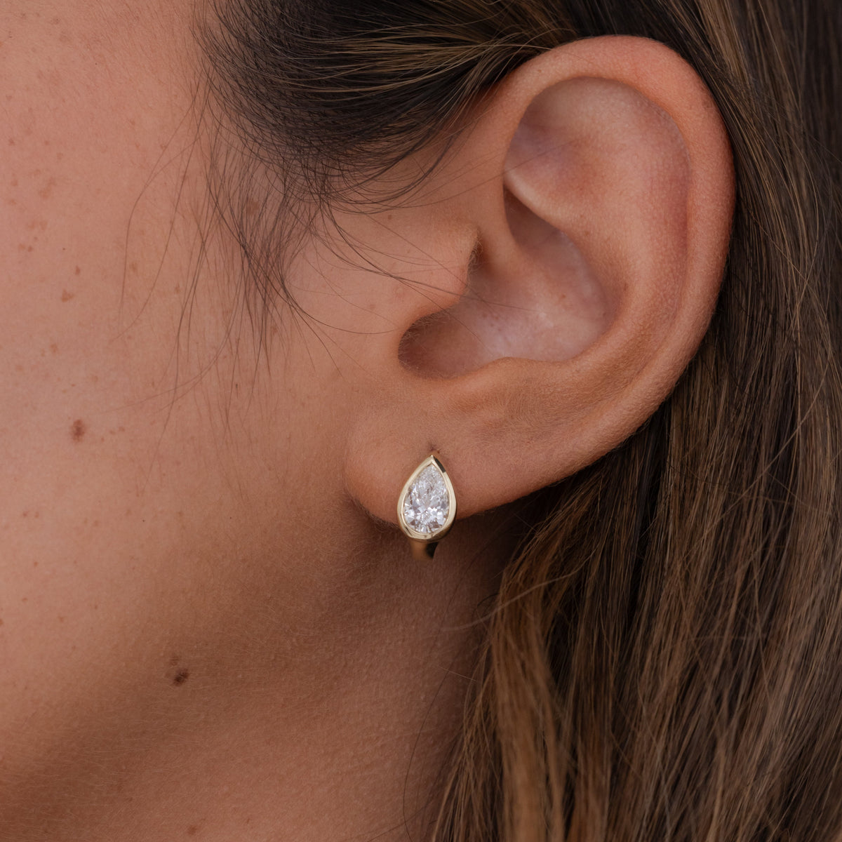 Aria Bezel Pear Diamond Huggies