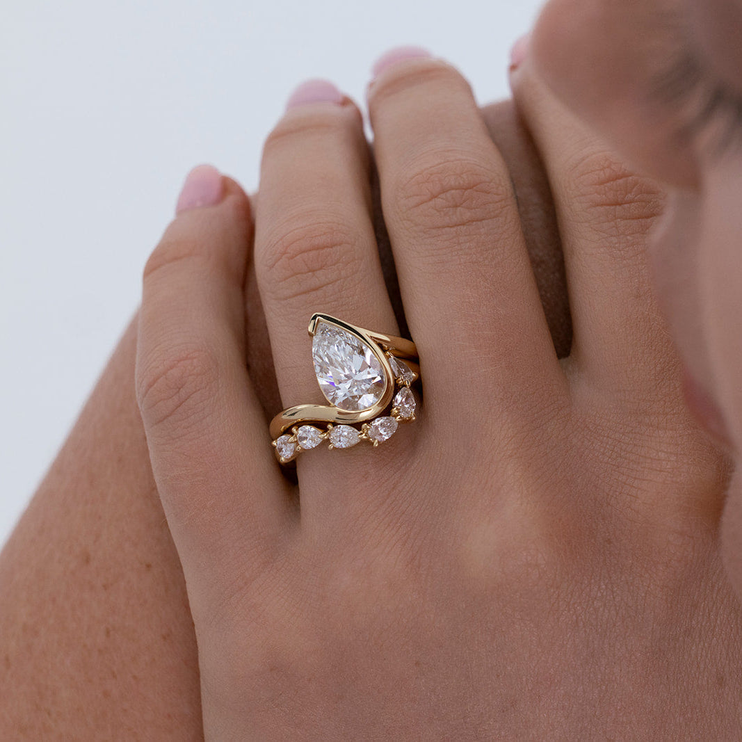 Oriana curved 6 diamond wedding band in 18k yellow gold