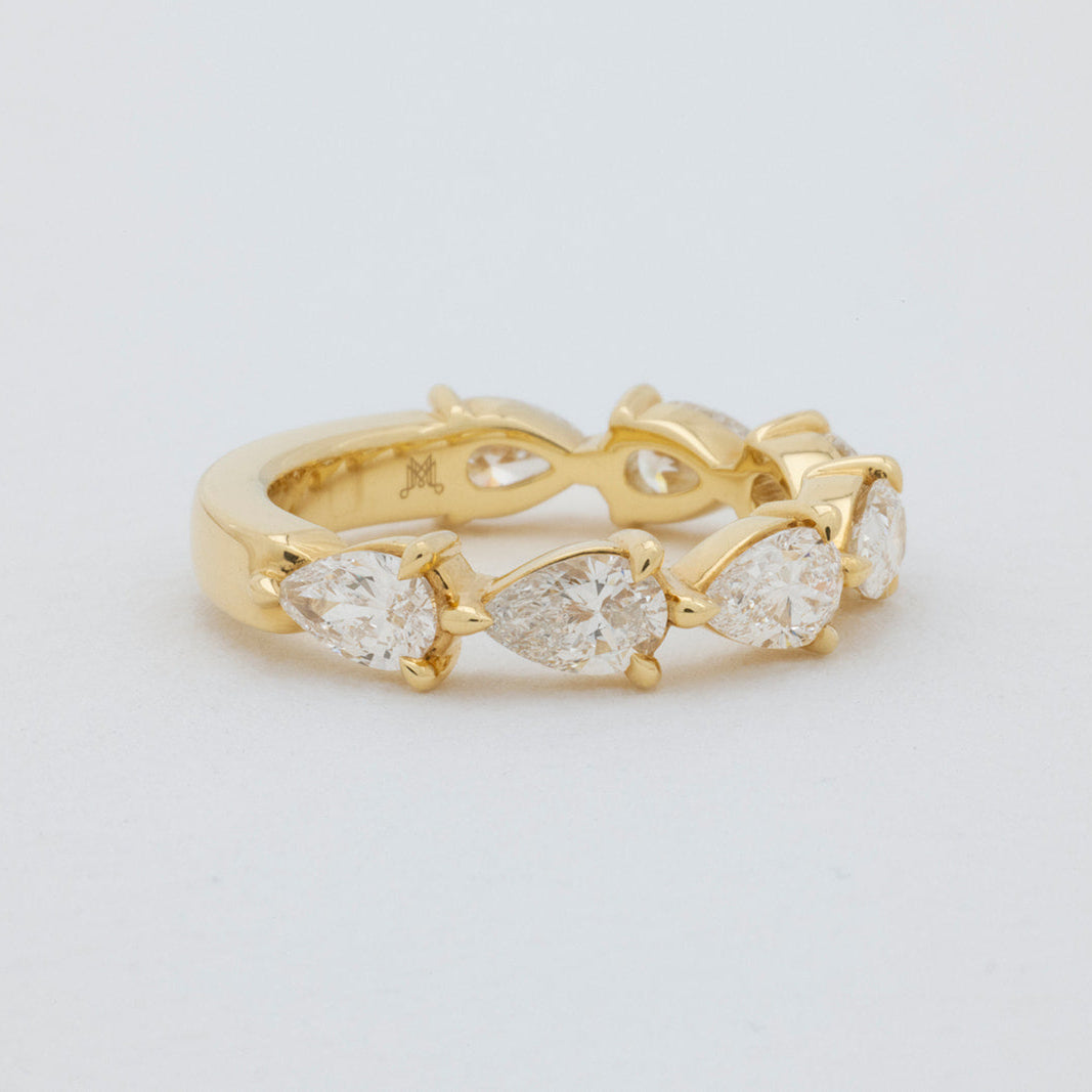 Pear Diamond Ring with 6-7 Diamonds