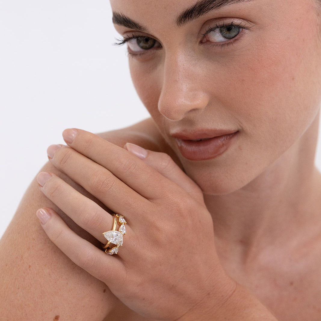 Pear Diamond Ring with 6-7 Diamonds