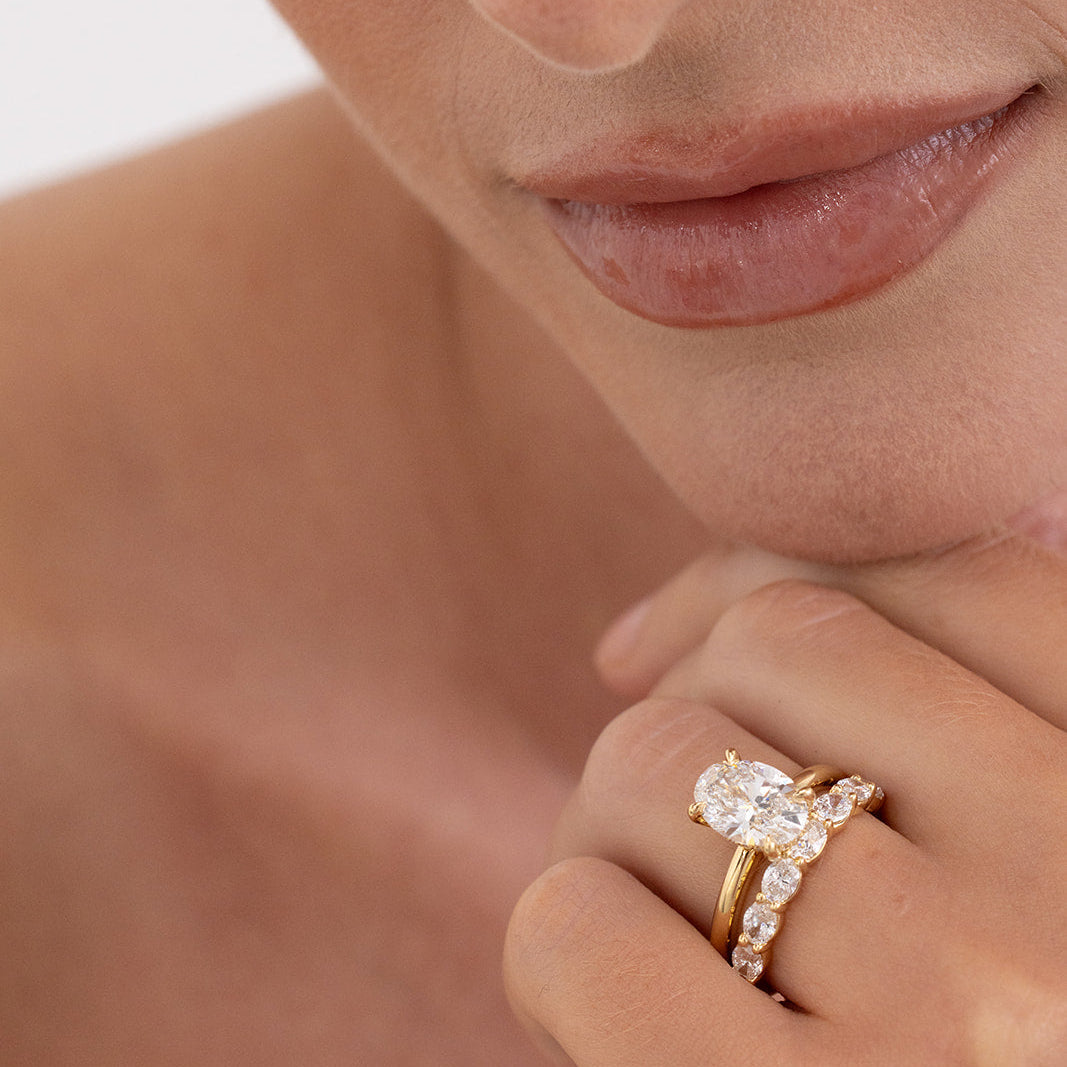 Oval diamond east west wedding ring in 18K gold with 7 lab-grown diamonds from Matthews Jewellers Newcastle
