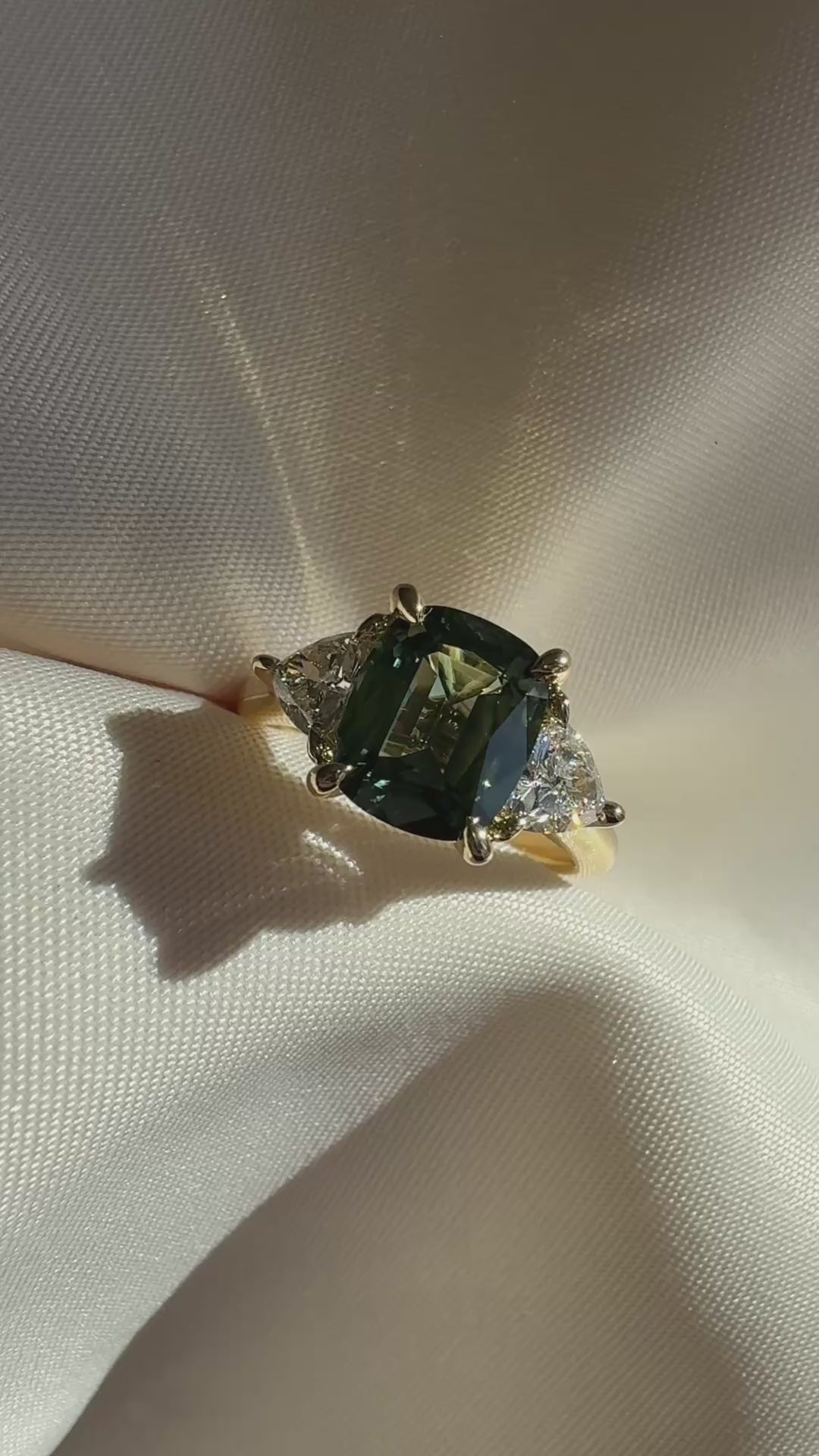 Cushion-cut Australian parti sapphire engagement ring with a 2.61ct natural sapphire, lab-grown diamond, 18k yellow gold cathedral setting.